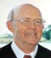 Bald white man wearing glasses with black jacket and white shirt - Rev. Weston “Wes” A. Stevens (1932-2025
