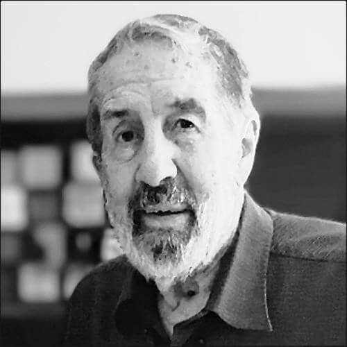 Rev. George Whitehouse in jacket. He has beard with go-tee and photo is black and white.